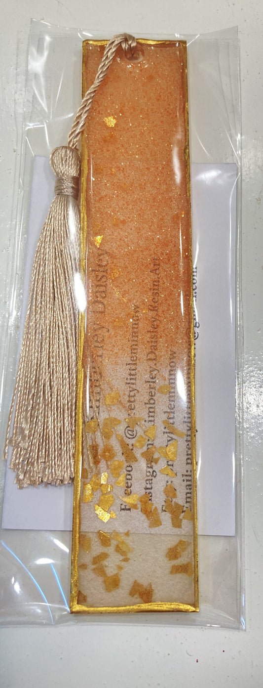 Clear bookmark with Gold and Copper color speckles with gold trim and gold tassel